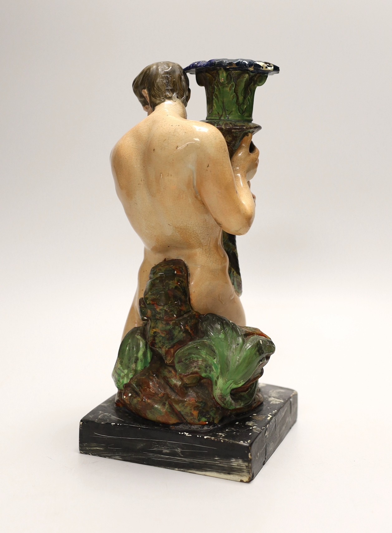 A pearlware ‘Triton’ figural candlestick, attributed to Wood & Caldwell, c.1800, 24cm, after a design by John Flaxman